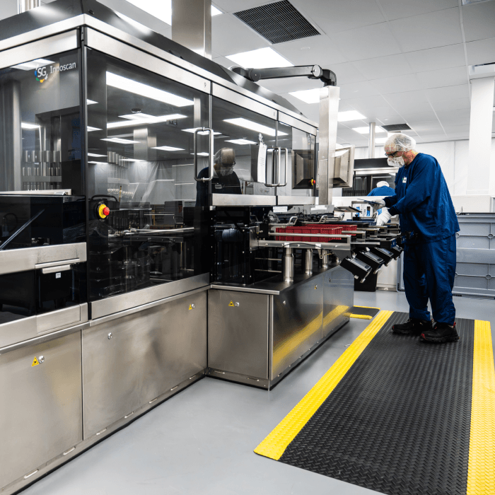Image of a scientist in a laboratory with large analytical equipment