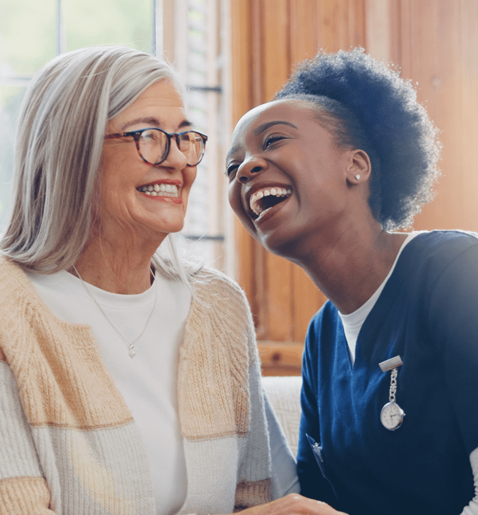 Image of two people smiling and laughing