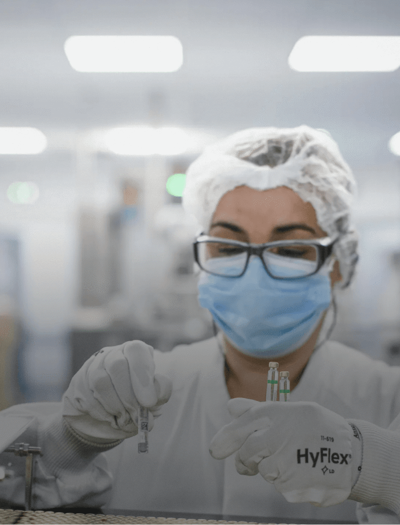 Image of scientist handling vials